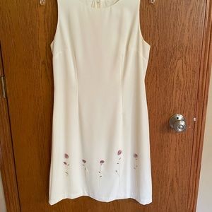Stunning white / cream dress with embroidery flower details at hem.